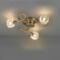Antique brass light that is semi flush so it sits close to the ceiling, with 3 glass shades.